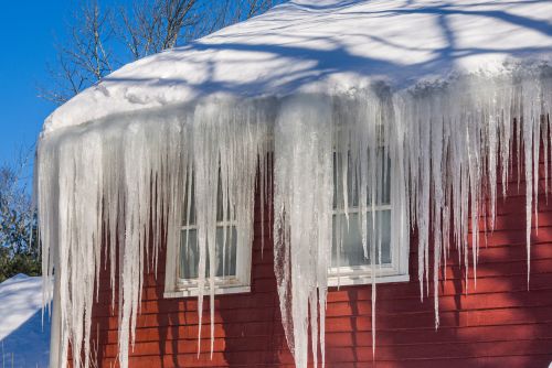 How Snow And Ice Can Damage Your Roof